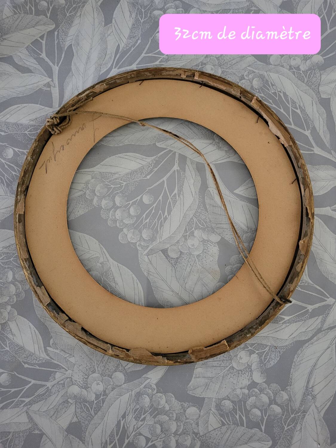 Round gilded wooden frame