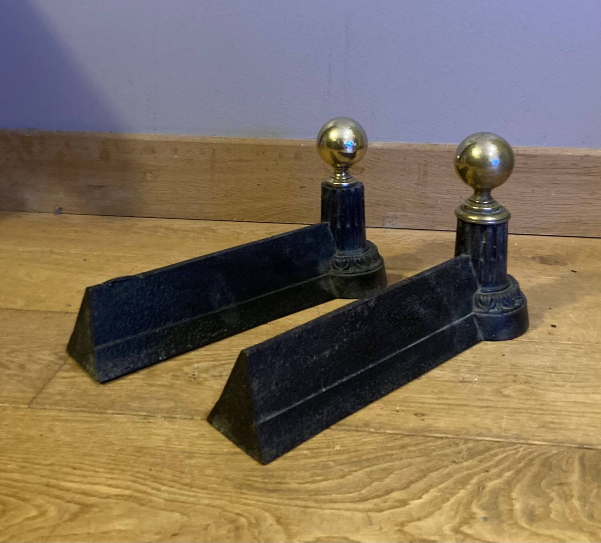 Pair of Napoleon III andirons from the 19th century in cast iron and brass