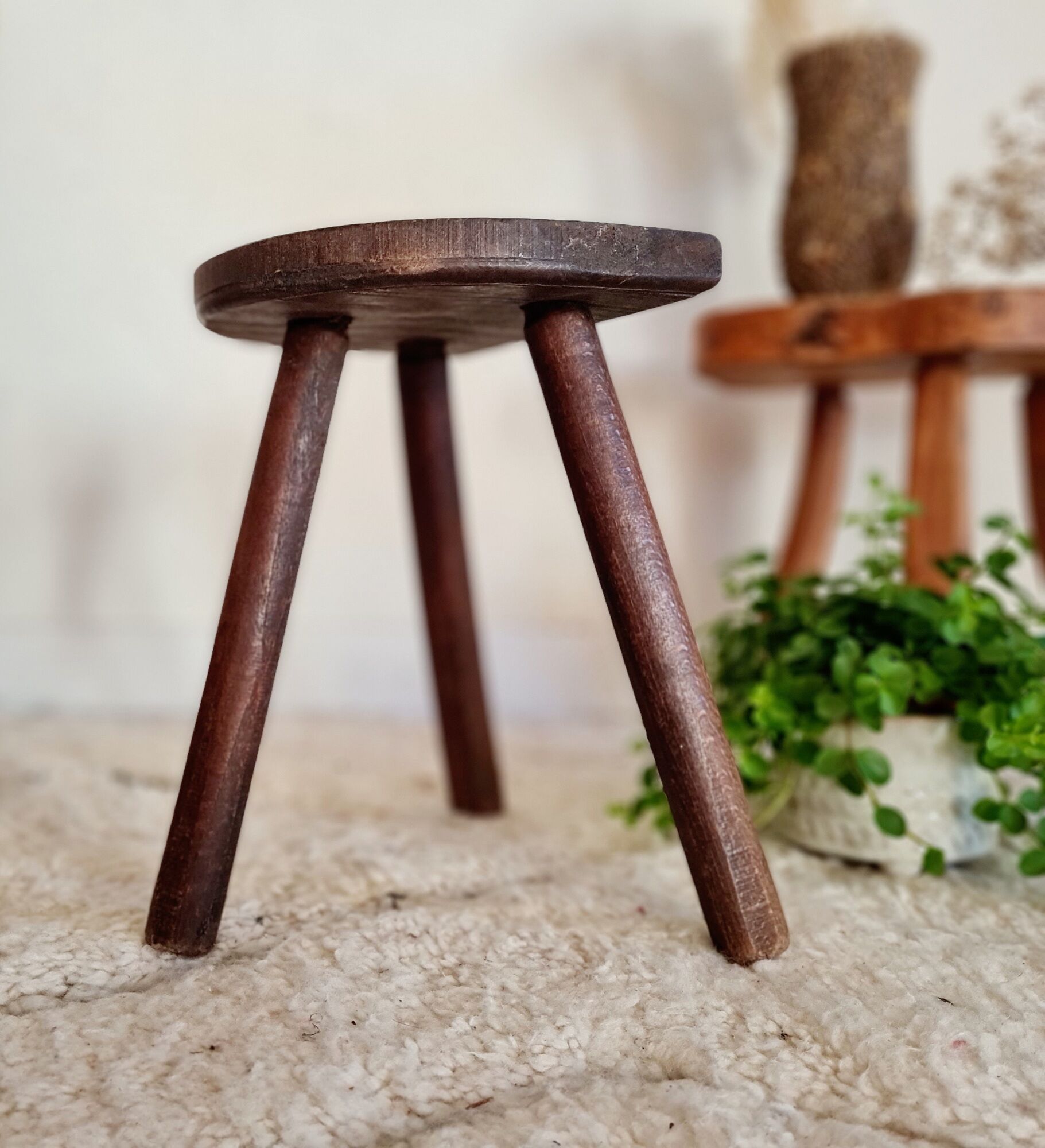 Old wooden tripod wooden farm stool made of wood