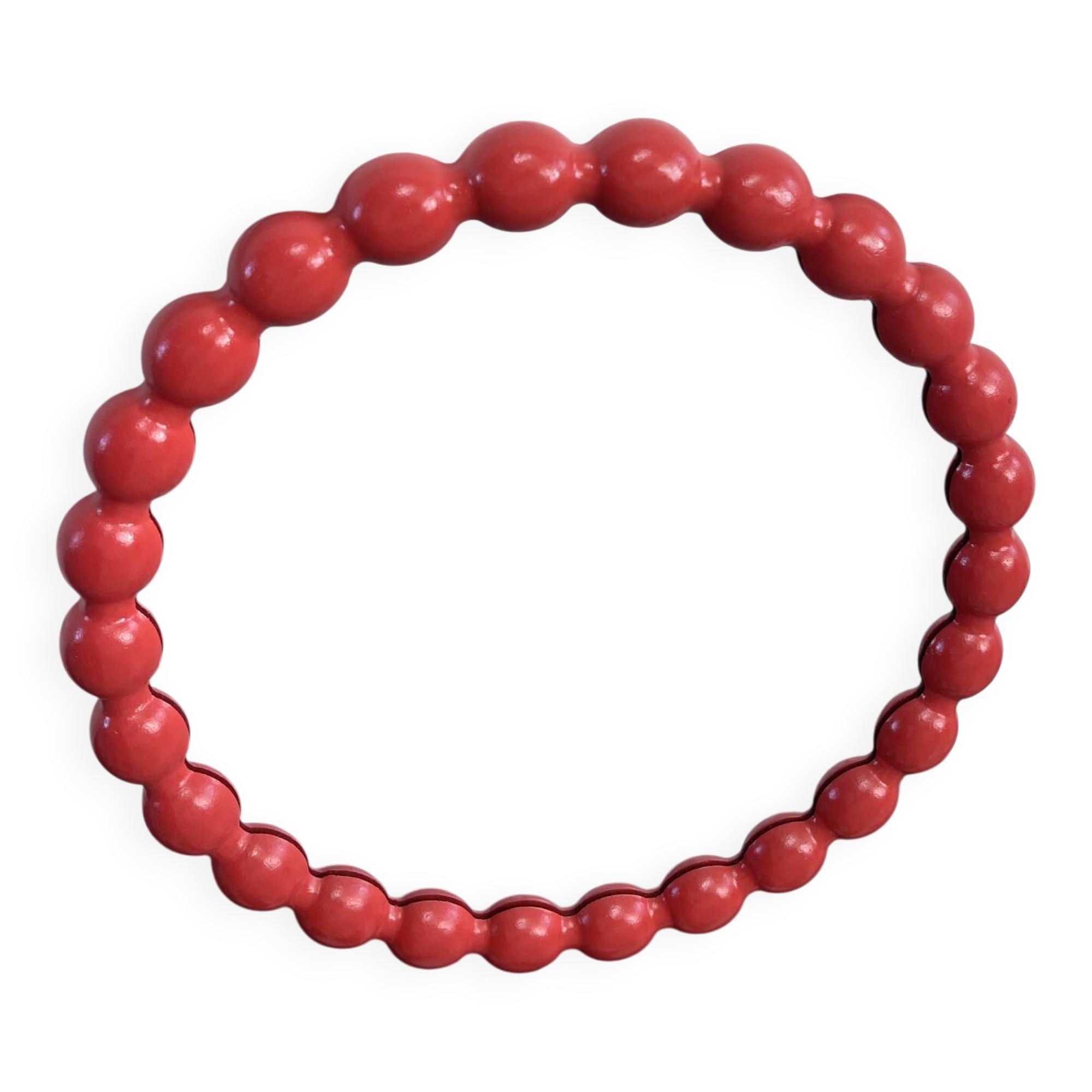 Round wall mirror with red beads in vintage retro design style.