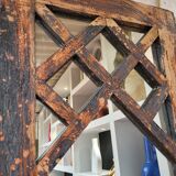 Wooden mirror mounted on old door