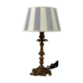 Lamp to lay brass feet offal white and gray day