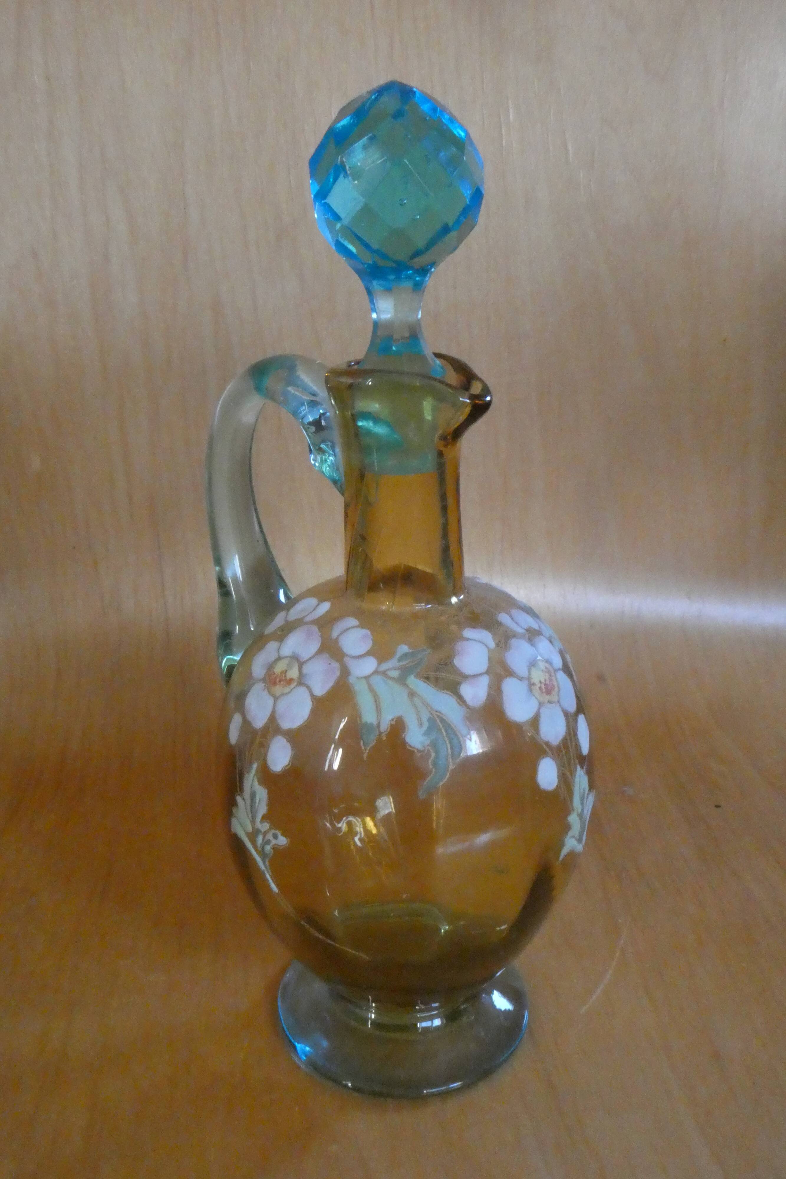 Enamelled liqueur decanter with floral decoration