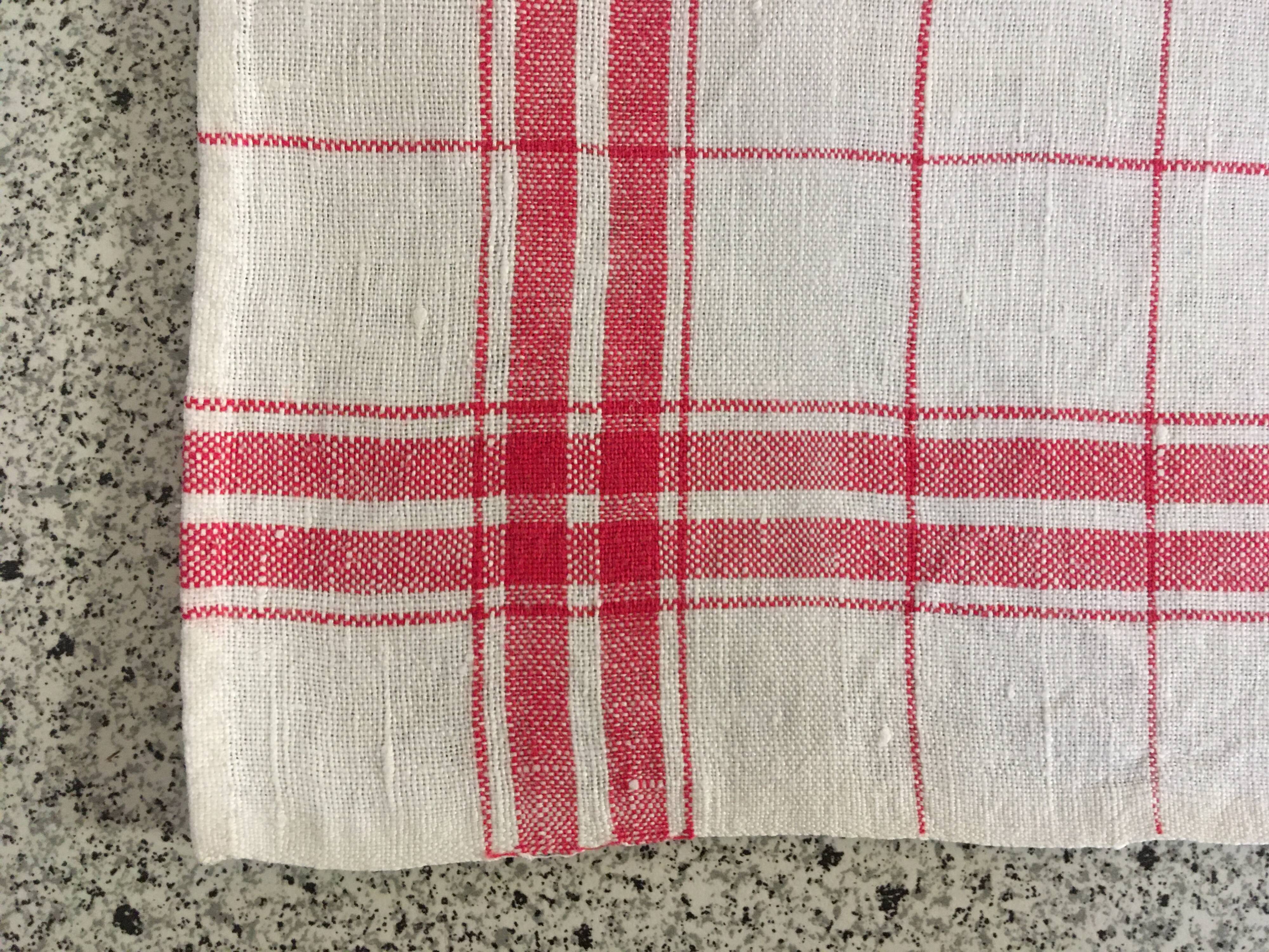 4 red mixed-race tea towels