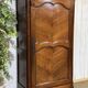 Louis XV bonnetière in cherry wood, early 19th century.