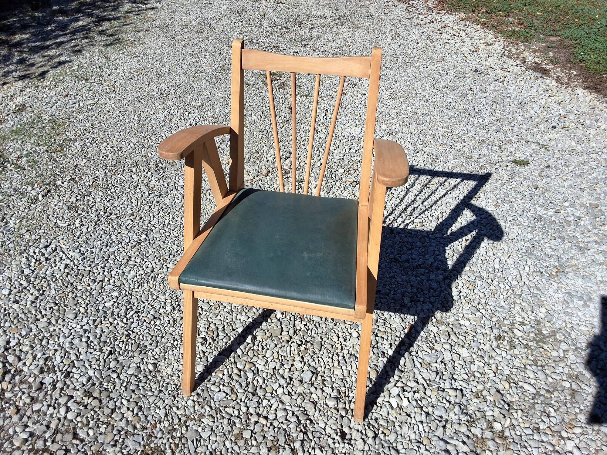 Compass leg armchair
