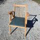 Compass leg armchair