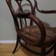 Canned armchair in curved wood signed J.Kohn