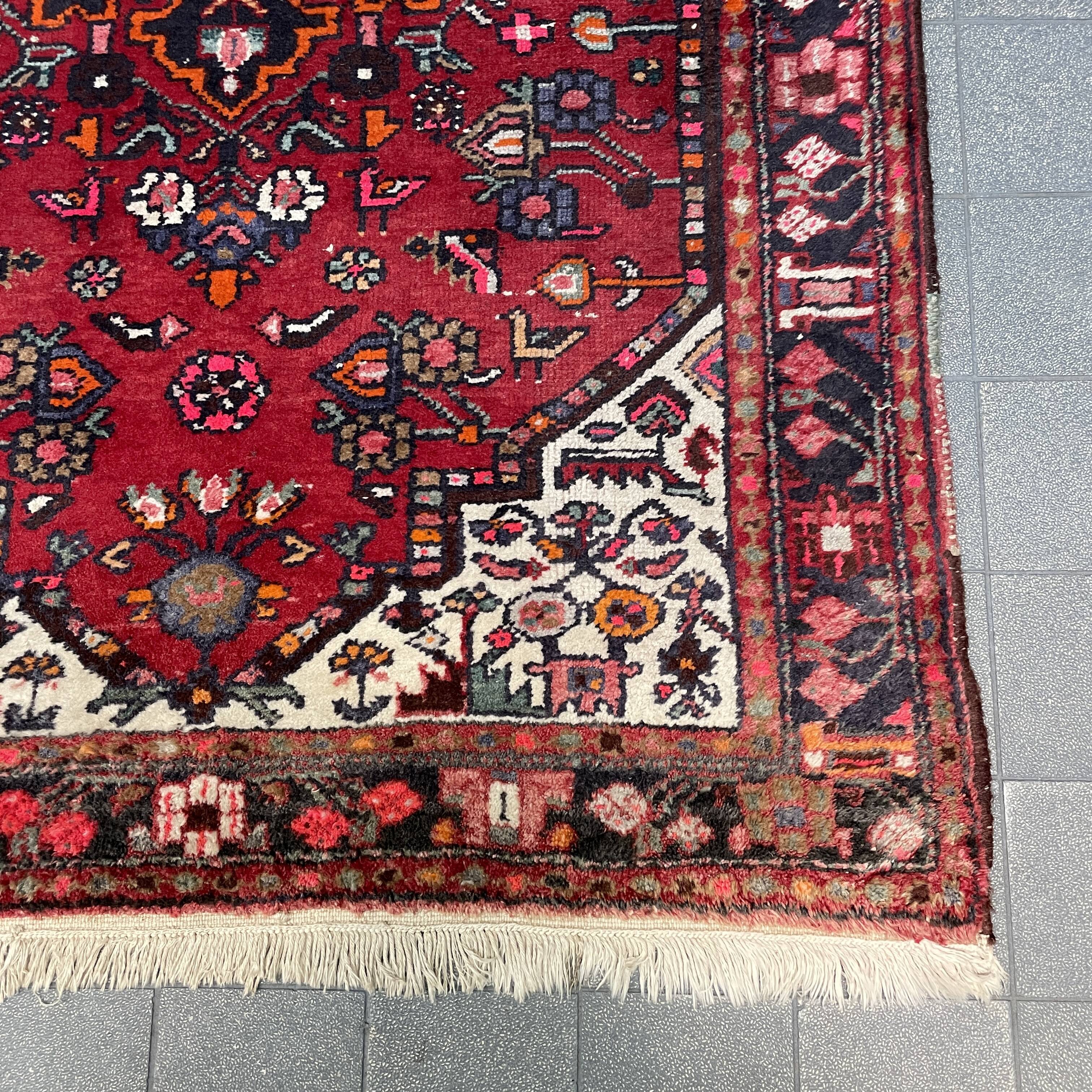 Worn vintage oriental rug or carpet