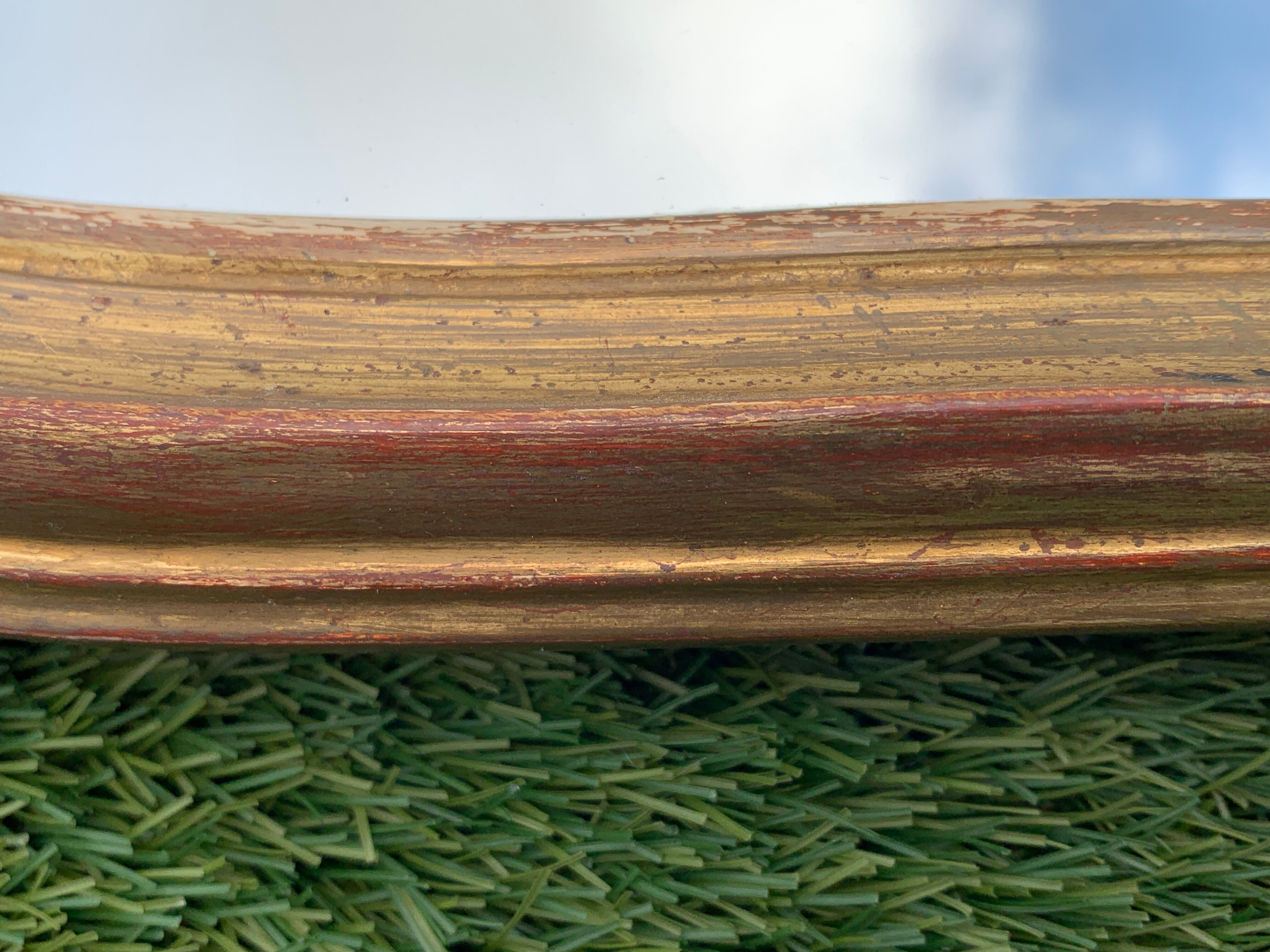 Old mirror in carved wood and gilded leaf, Louis XV rocaille style, twentieth century 59x87cm