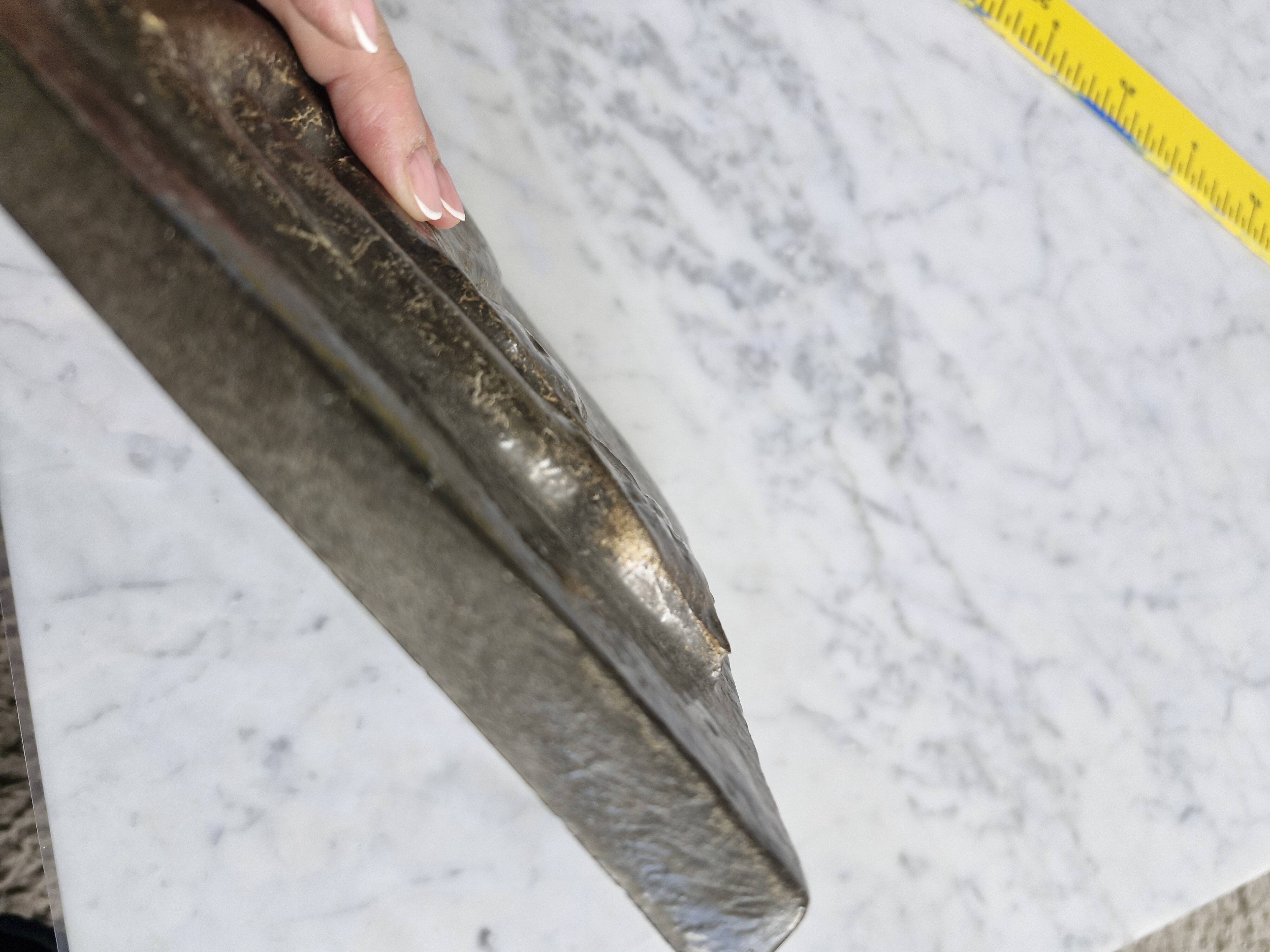 Bas-relief plaque of a rabbit in brown patina, seated cat