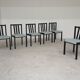 Set of 6 modernist black chairs with light blue-green ribbed fabric.