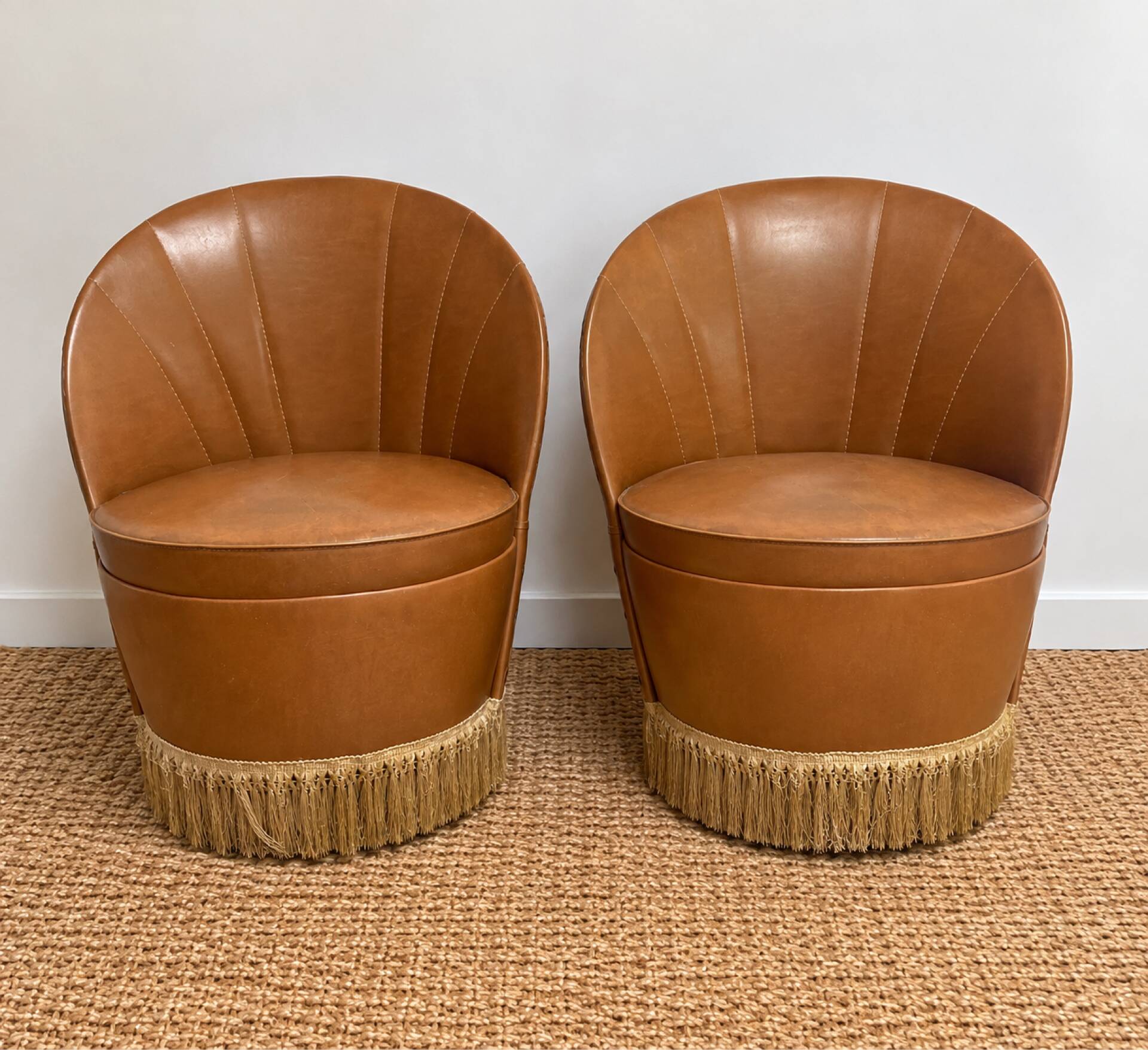 Vintage cognac fringe tub chairs