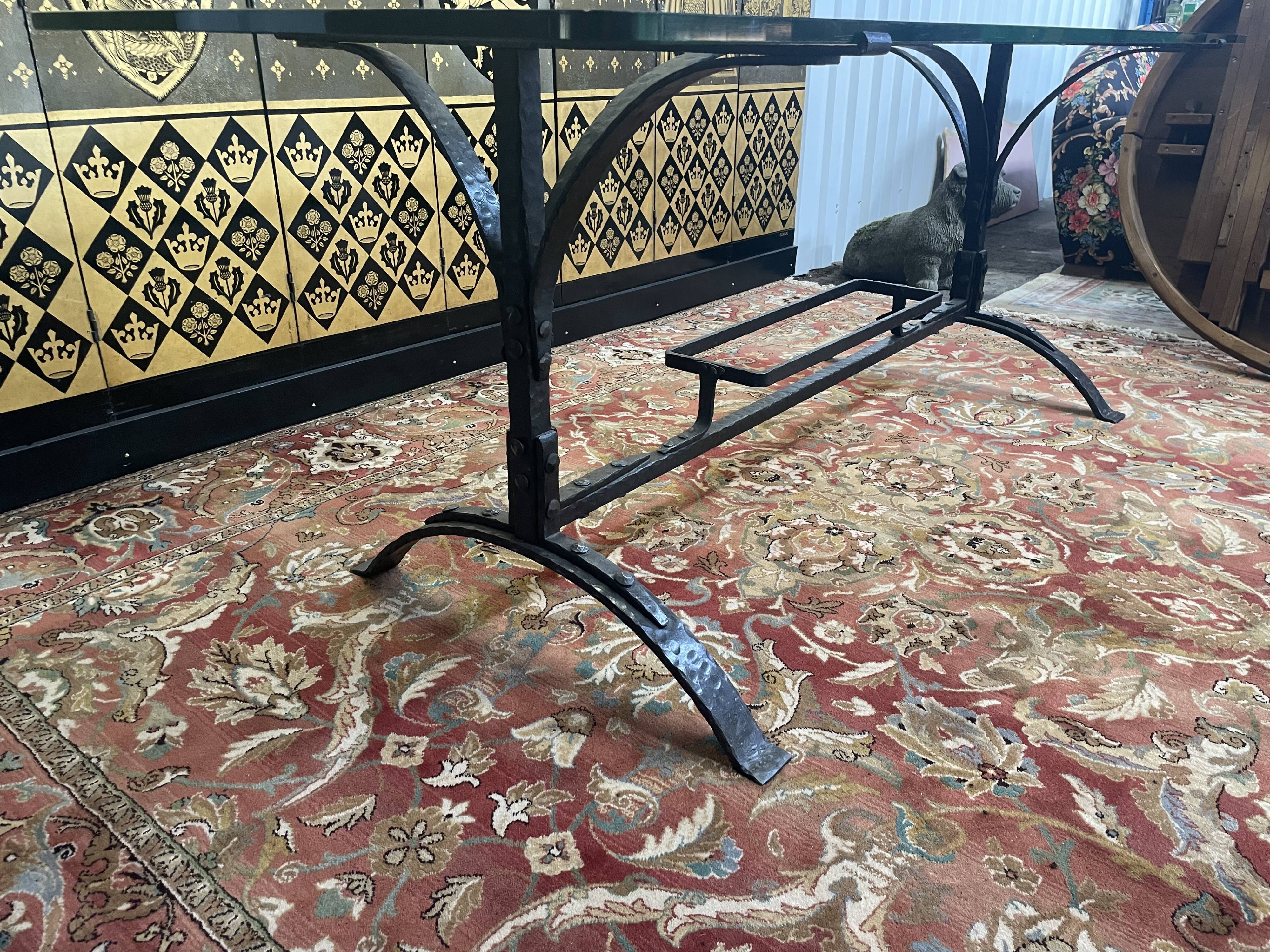 Dining table in wrought iron and glass