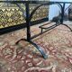 Dining table in wrought iron and glass
