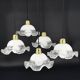 Set of 5 scalloped white opaline flower pendants, braided black cable.