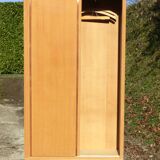 Small Scandinavian wardrobe with sliding doors - 1 side for hanging clothes.