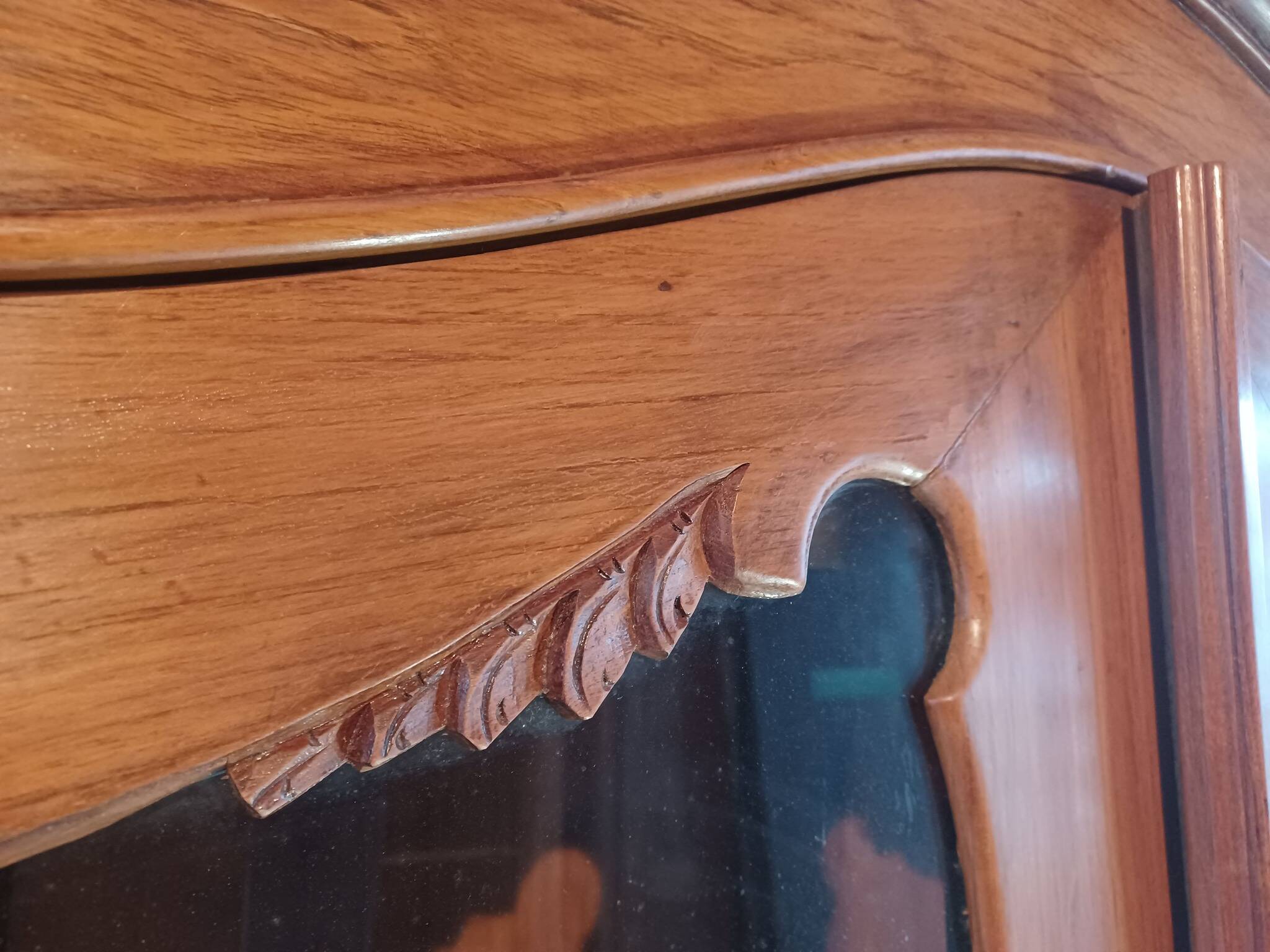 Large glass and carved cabinet