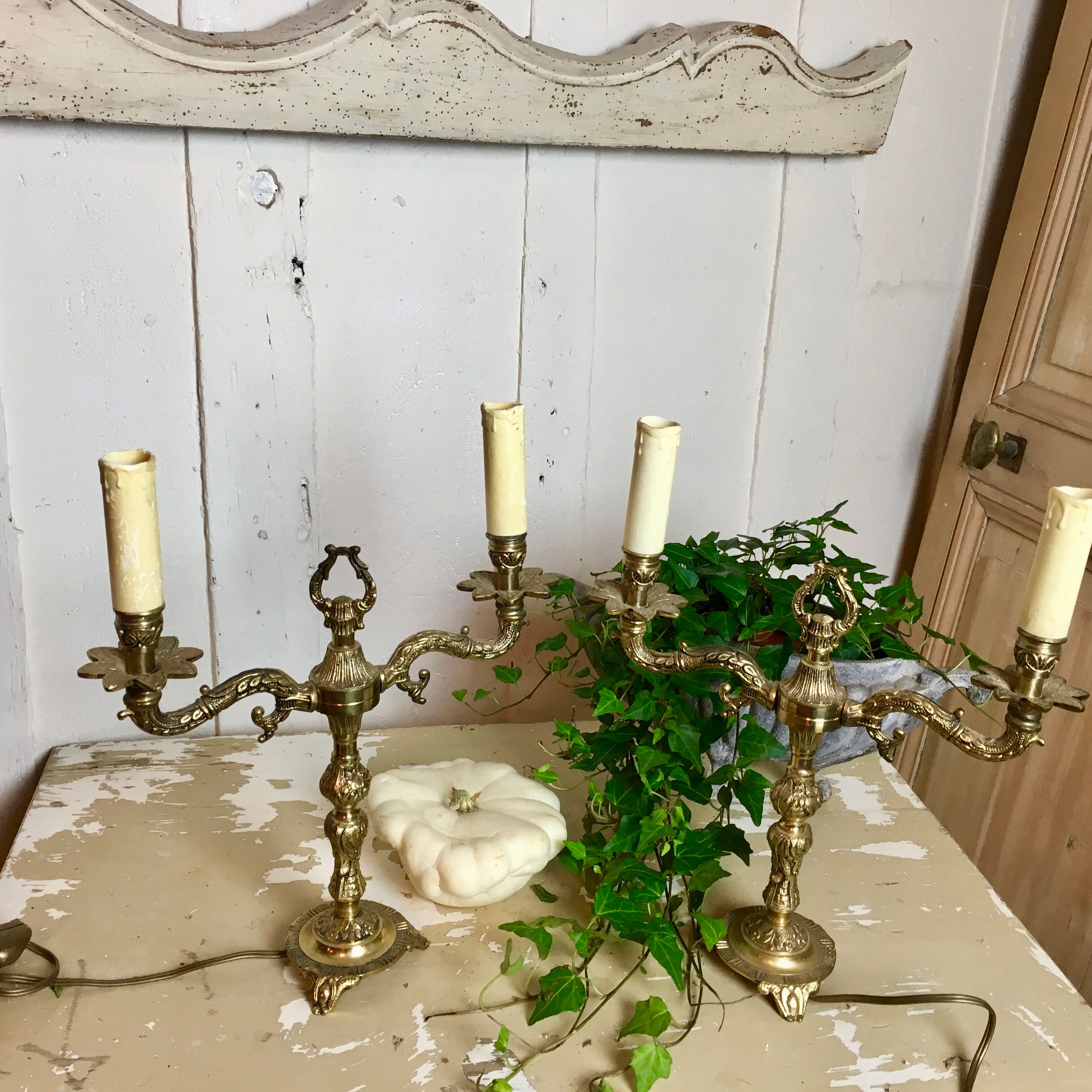 Pair of Louis XVI style double lamps in gilded bronze