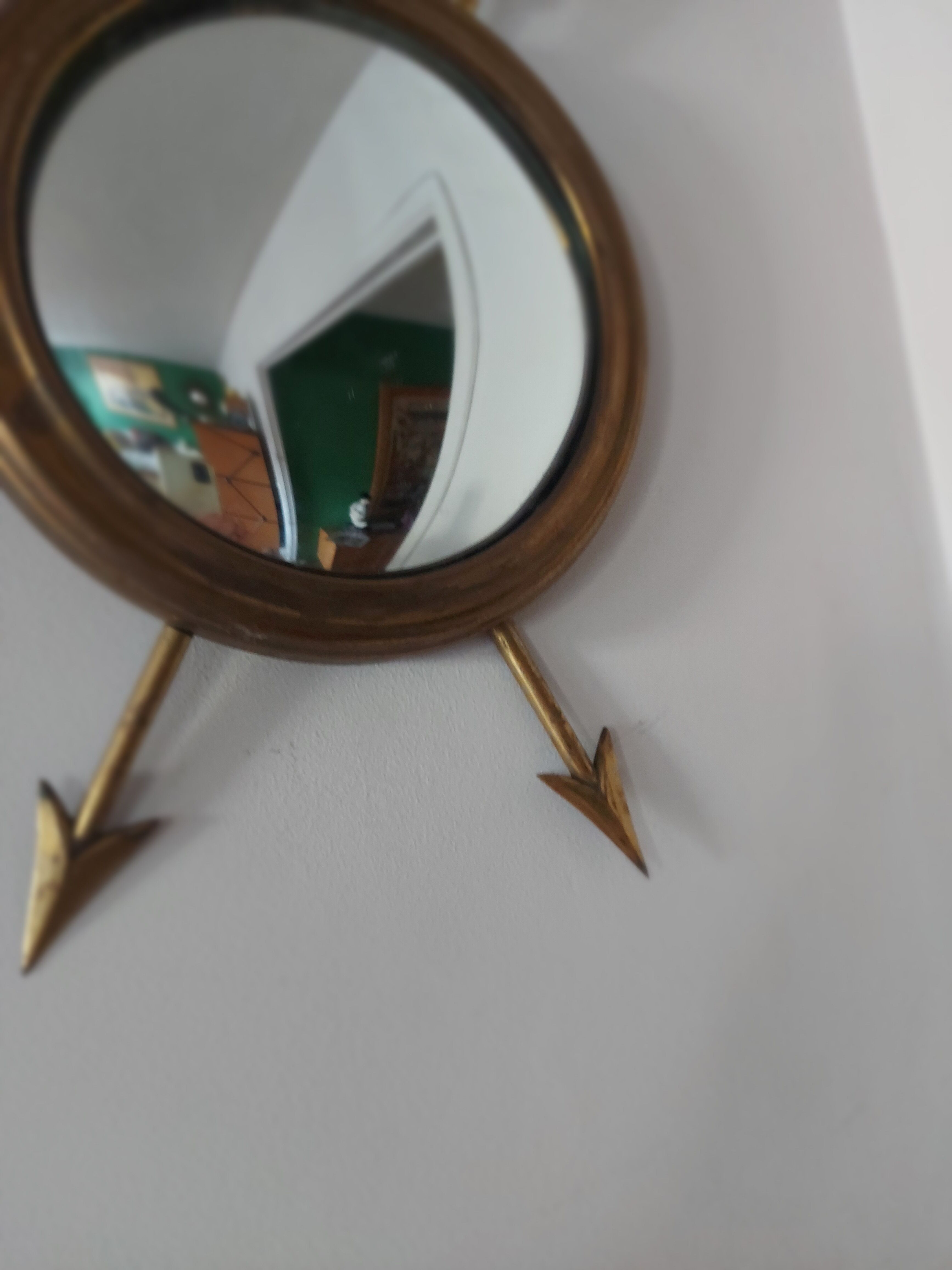 Curved brass witch's mirror