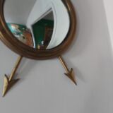 Curved brass witch's mirror
