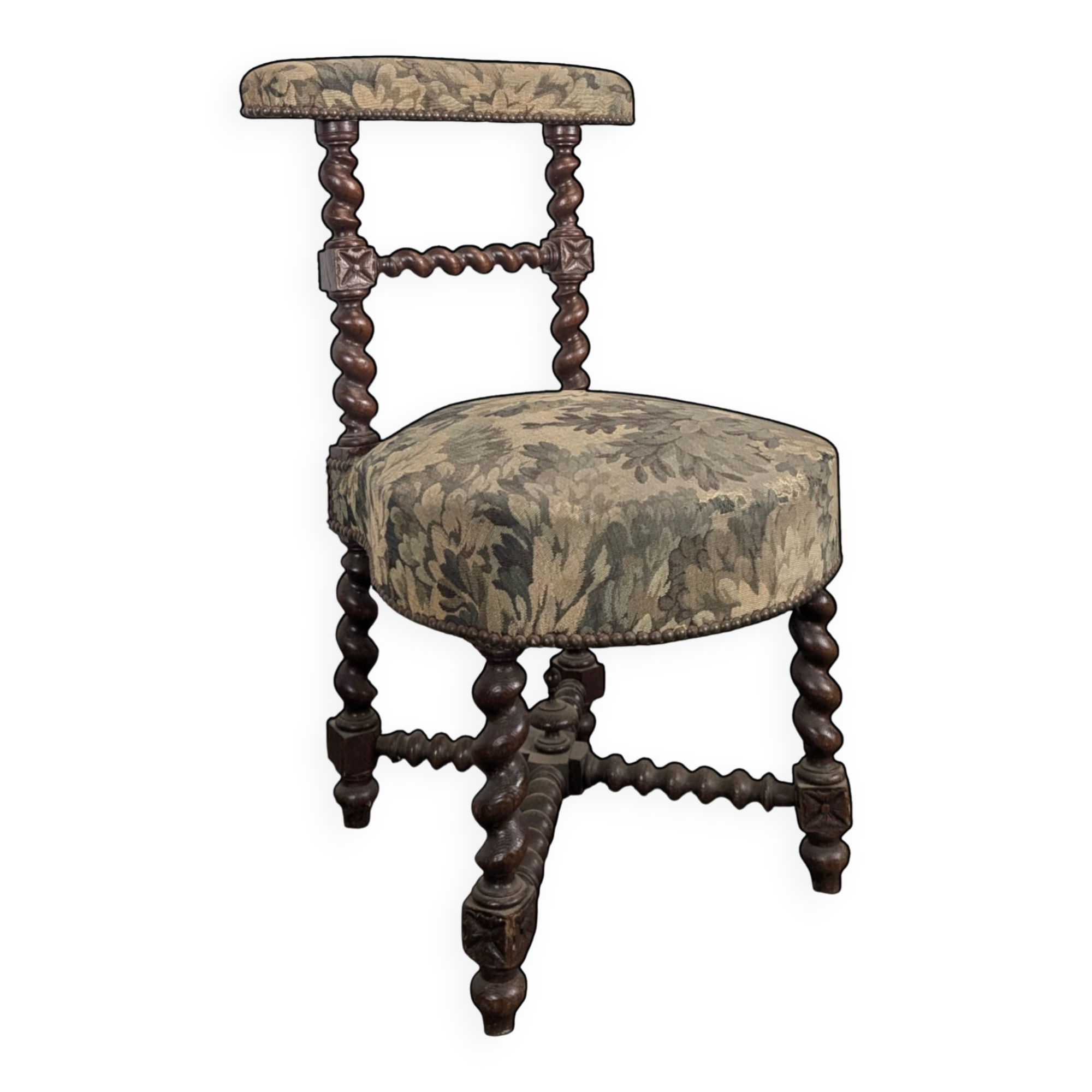 Napoleon III smoking chair in twisted blackened wood with foliage upholstery.