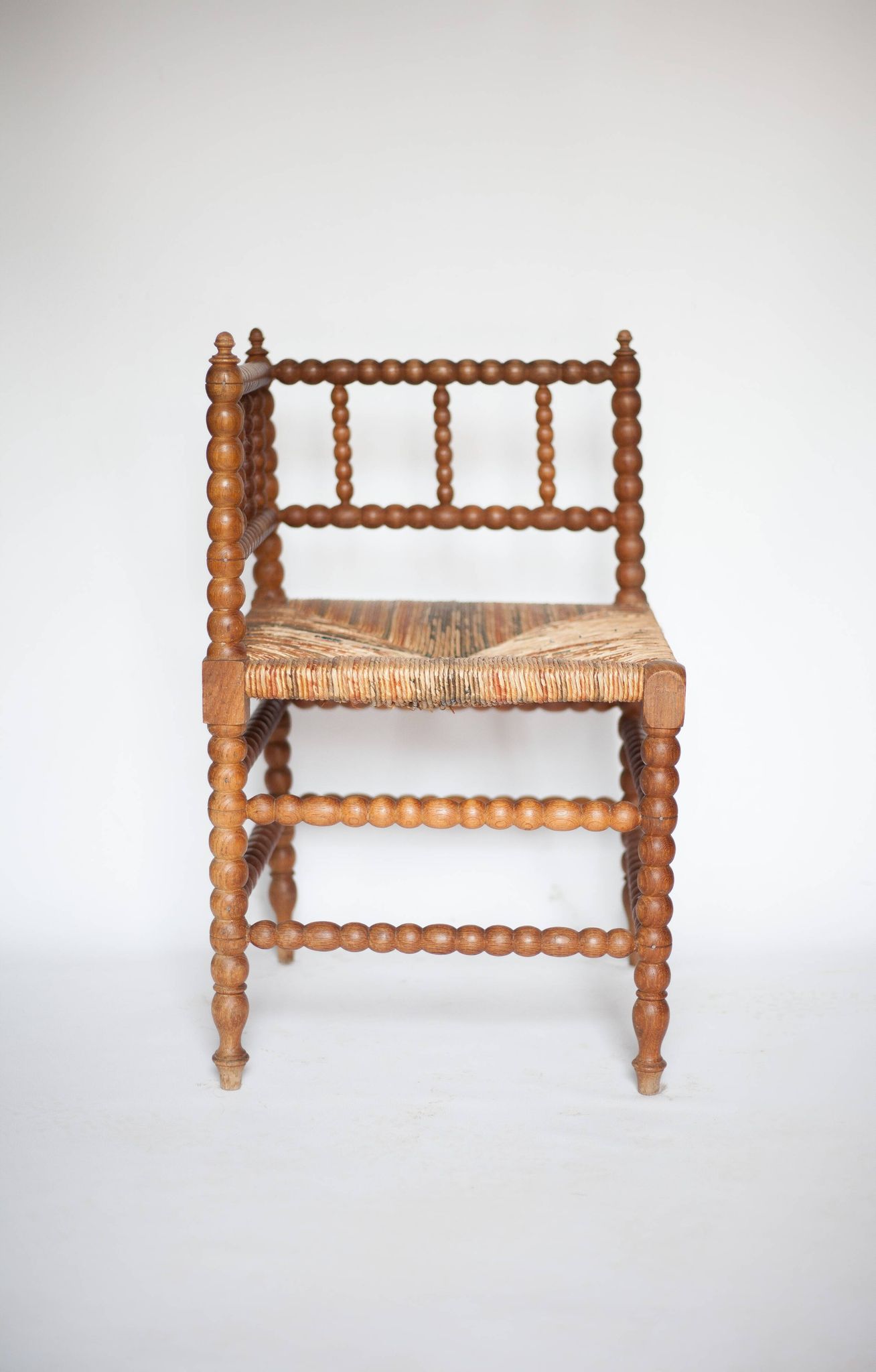 Wooden and caned corner chair, antique bobbin chair, occasional chair.
