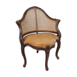Fauteuil de bureau louis xv, sculpté, canné, garni cuir