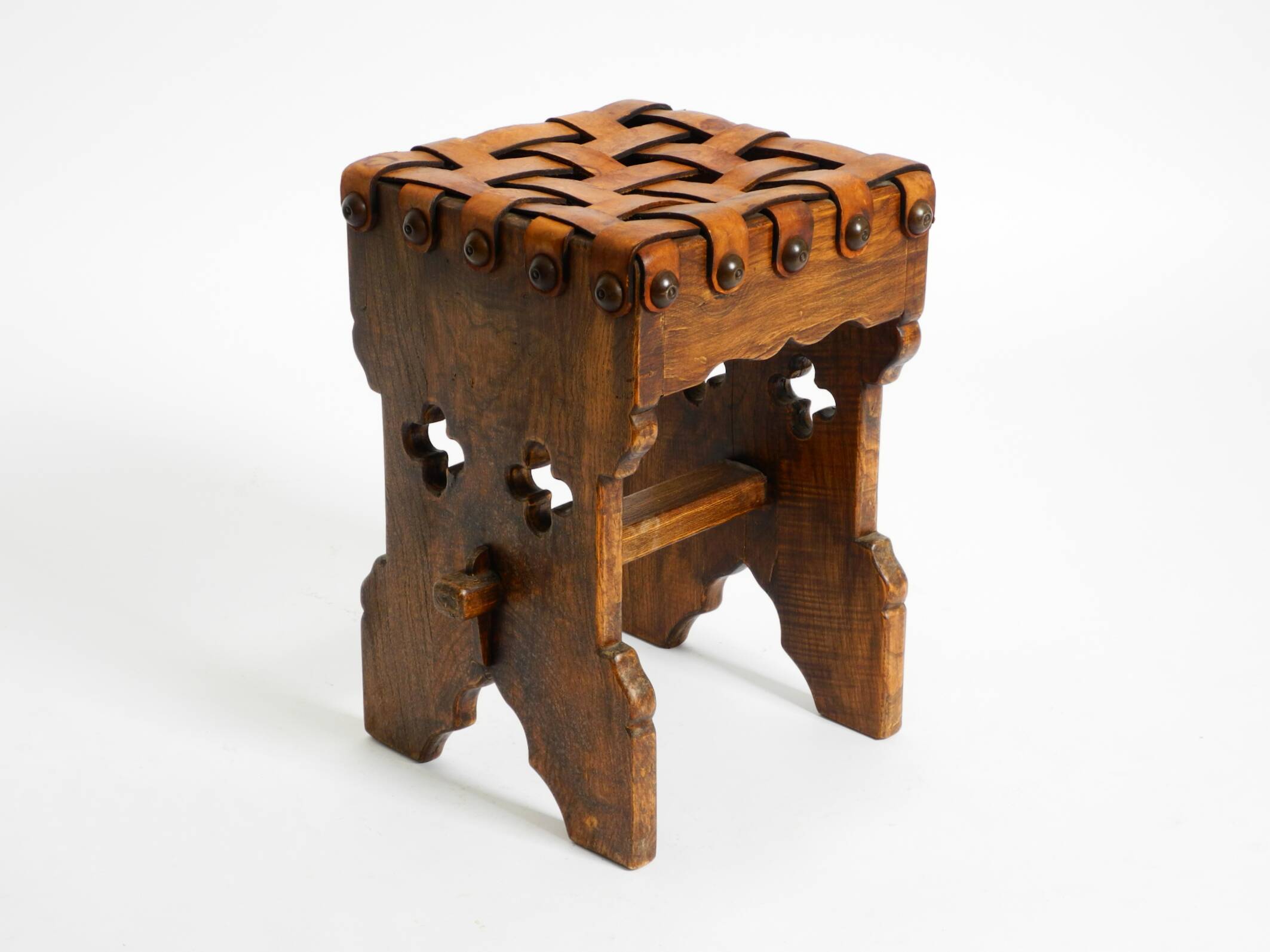 Beautiful 1940s oak stool with a seat made of leather straps