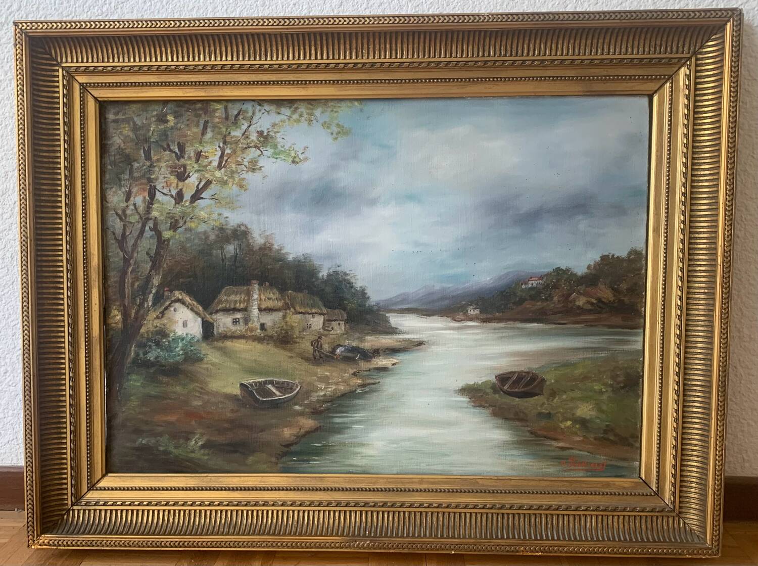 Large painting of a house by the water