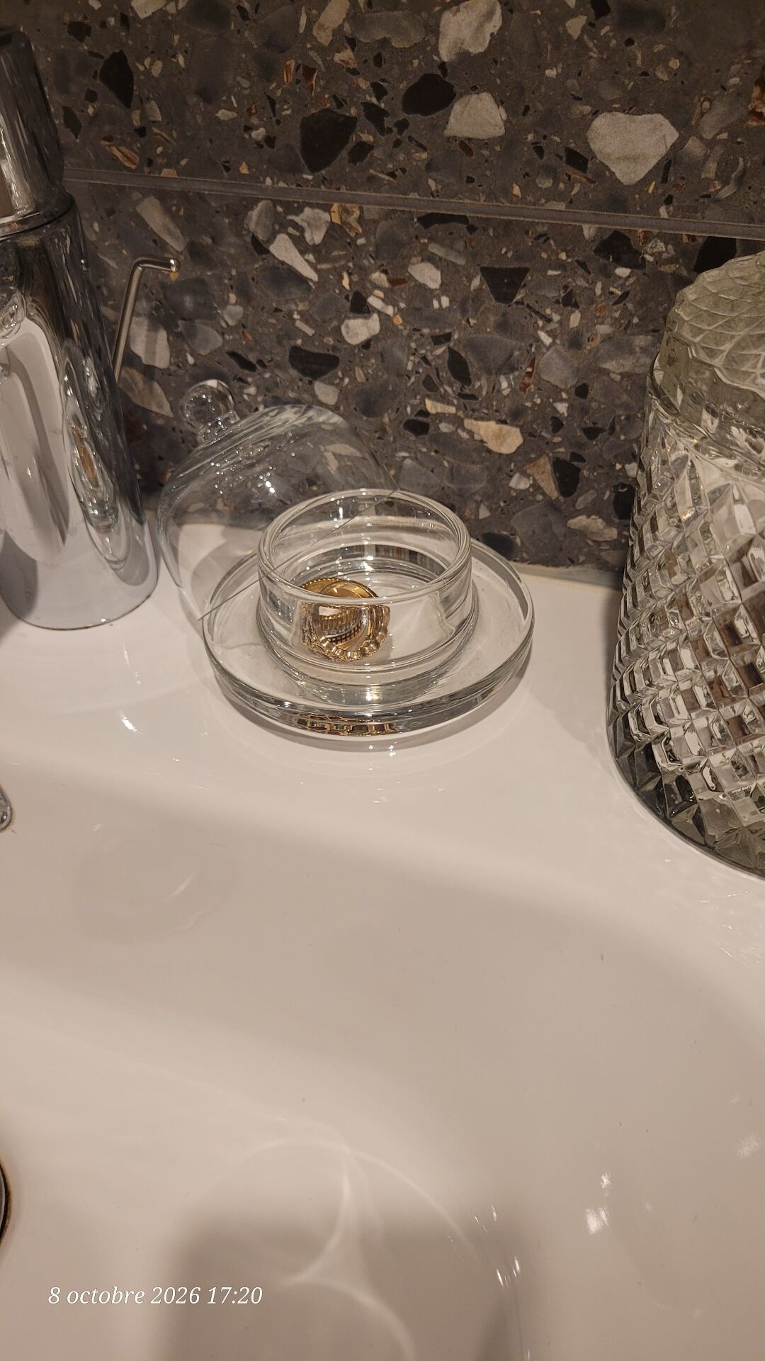 2 transparent glass butter dishes with their matching cloches.