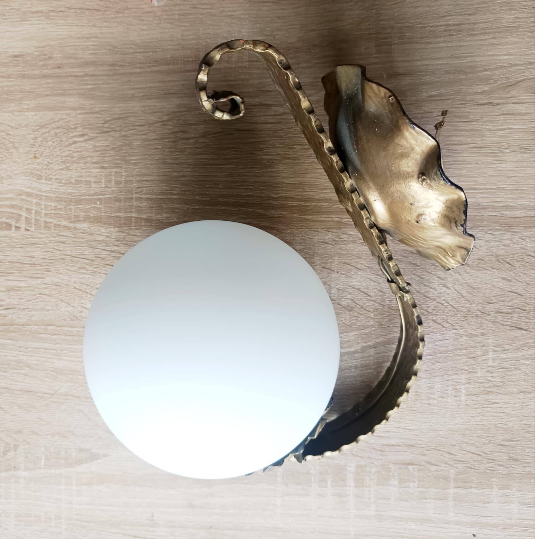 Pair of brutalist wall sconces in gilded metal from around 1970.