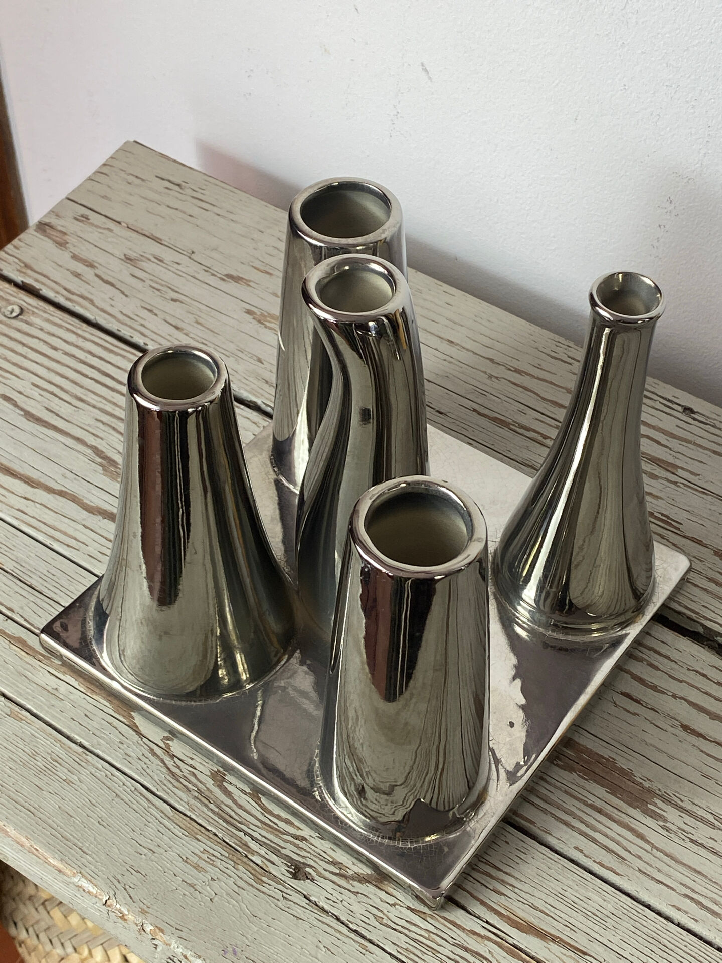 Asymmetrical multitube vase on a base, in silvered ceramic, 1970.