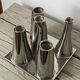 Asymmetrical multitube vase on a base, in silvered ceramic, 1970.
