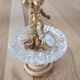 Footed catch-all / ashtray with cherub (glass and gilded metal)