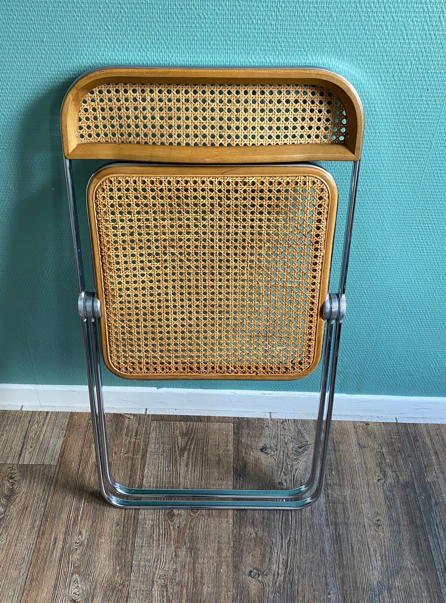 Wooden and caning folding chair "Plia" by G. Piretti for Castelli editions