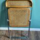 Wooden and caning folding chair "Plia" by G. Piretti for Castelli editions
