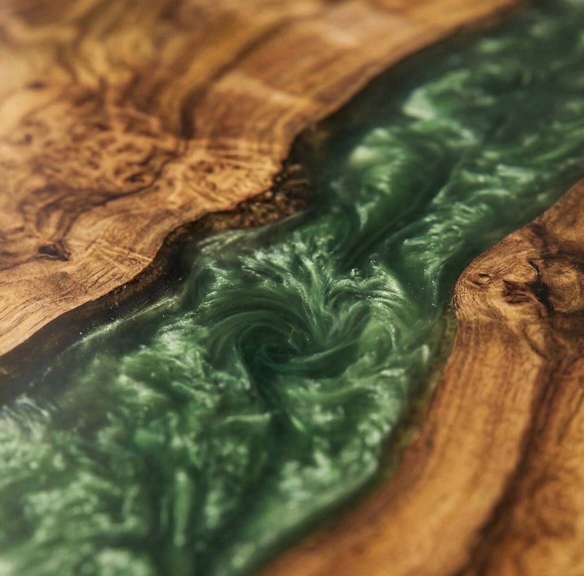 Round resin coffee table with a natural edge.