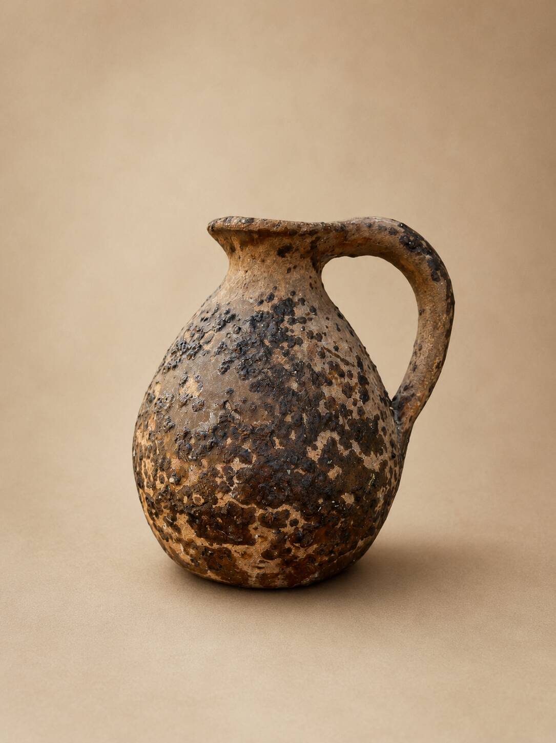 Ancient glazed terracotta jug