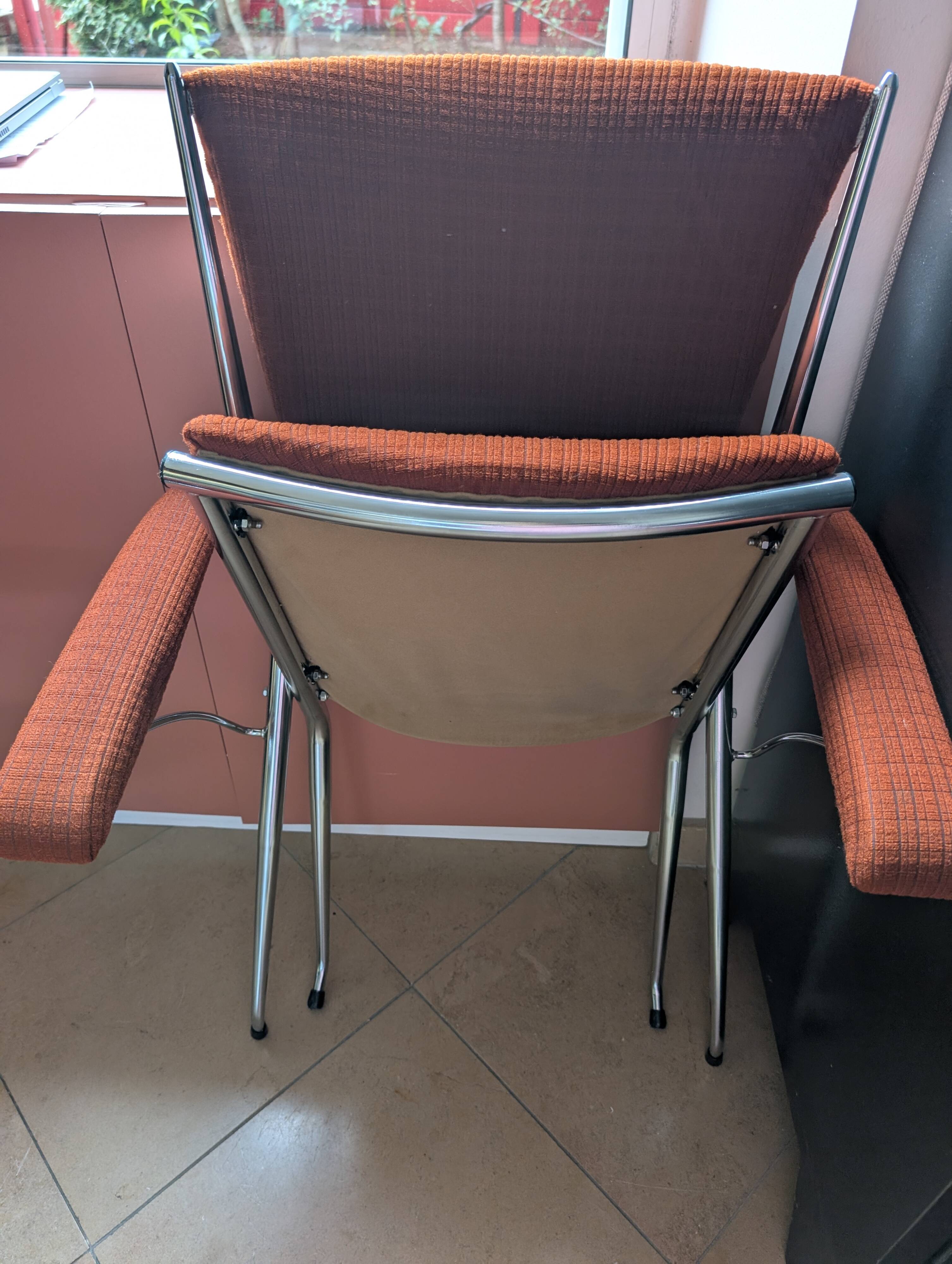 Pair of vintage folding chairs in terracotta fabric.