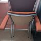 Pair of vintage folding chairs in terracotta fabric.