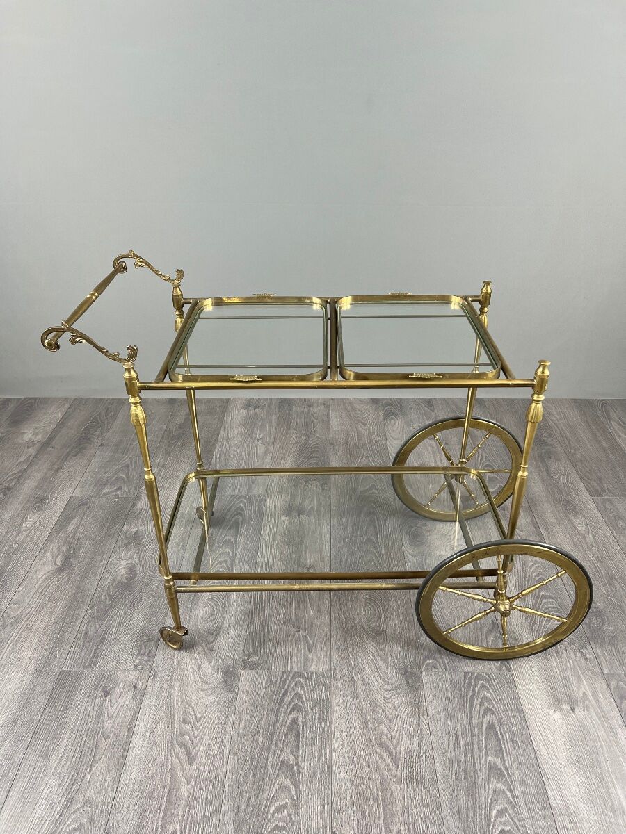 Rolling table cart in gilded brass with two glass shelves, 20th century.