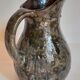 Potter's pitcher Art-popular in old enamelled earth