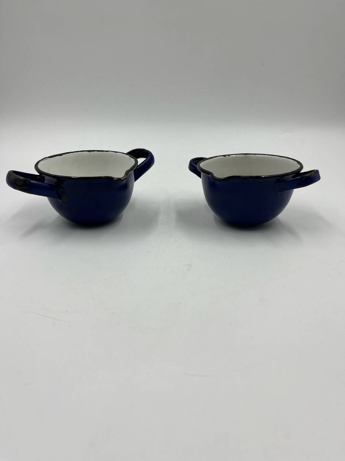 Enamelled metal fondue pot duo
