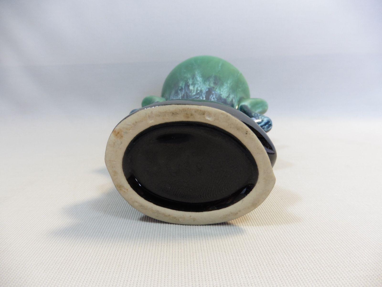 Praticality black and green vase numbered 666