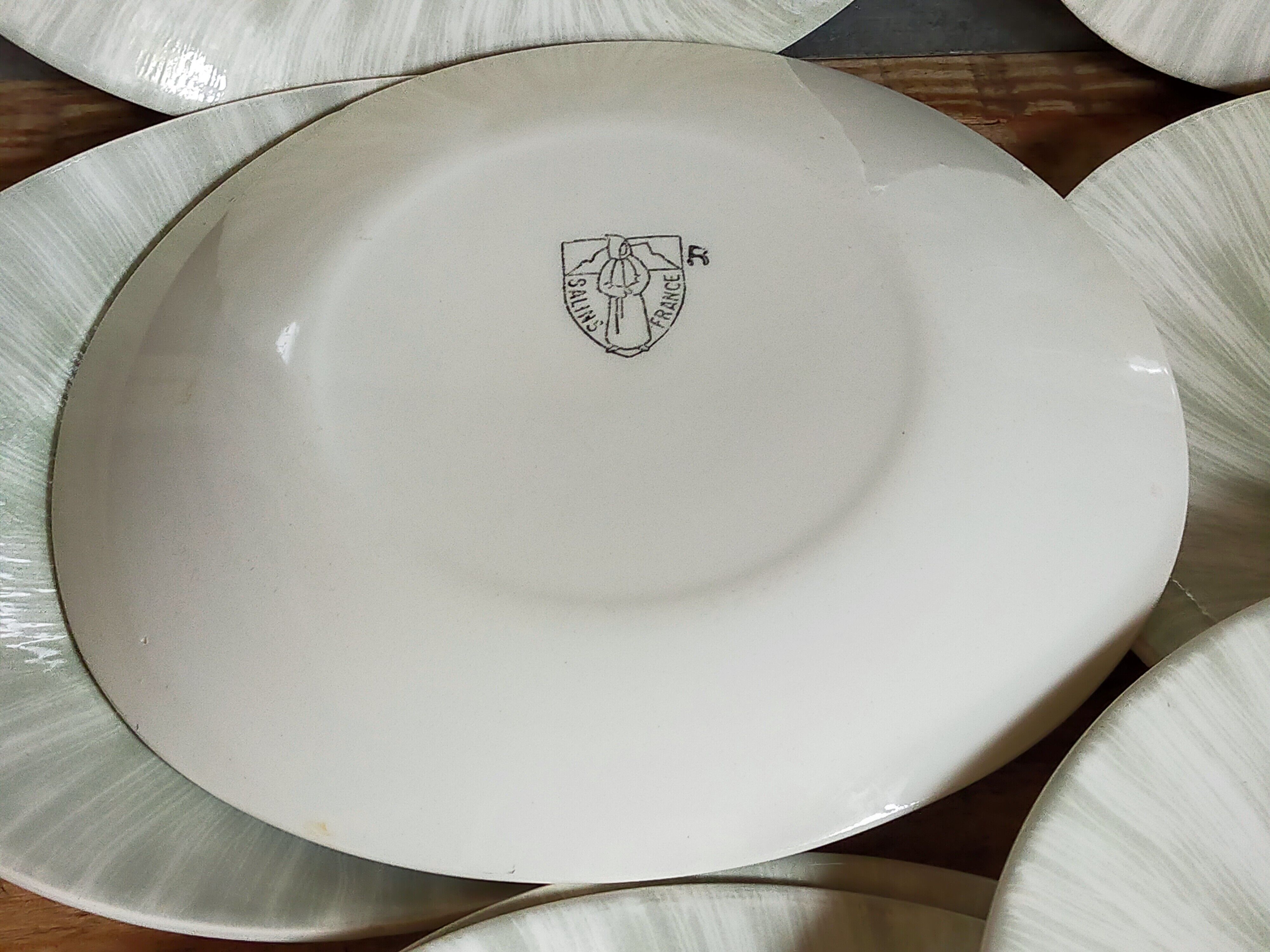 Nine earthenware plates from Salins-les-Bains vintage