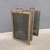 Antique fireplace screen in copper and brass from the 19th century.