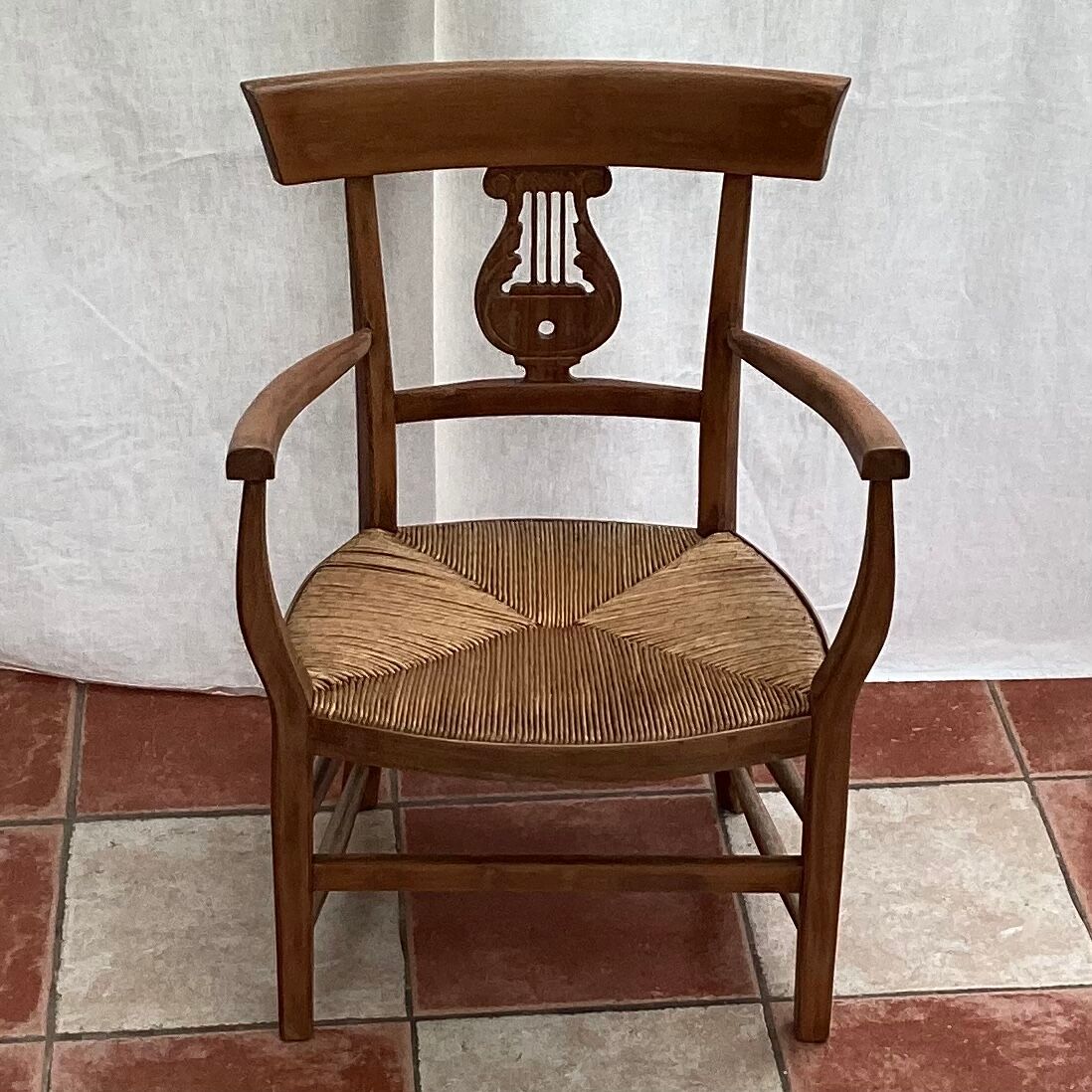 Light wood armchair seated in vintage straw dimension: height -78cm- width -54cm-
