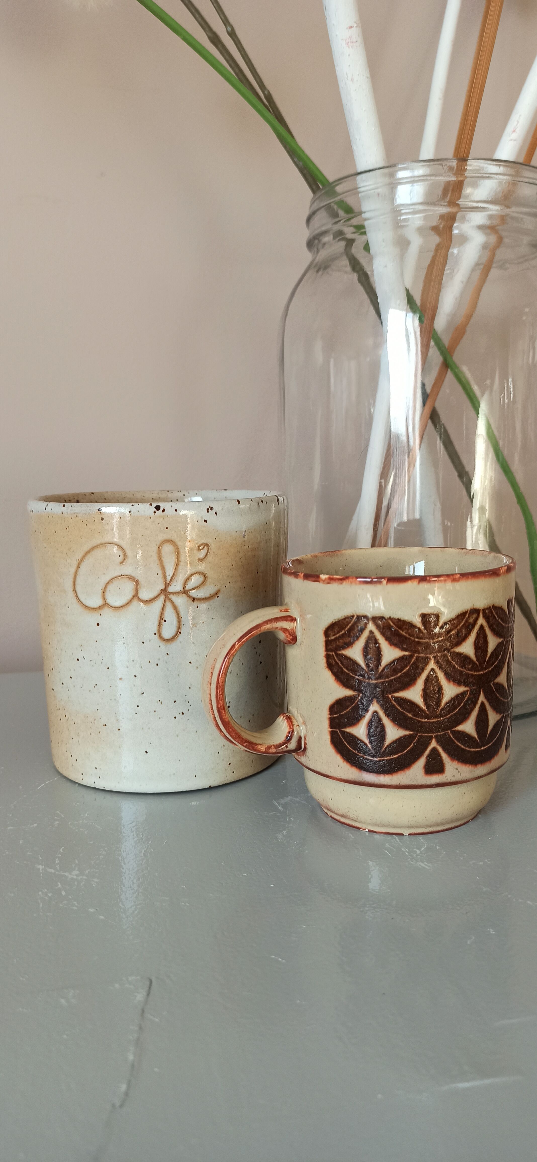 Coffee pot and mug cup in sandstone