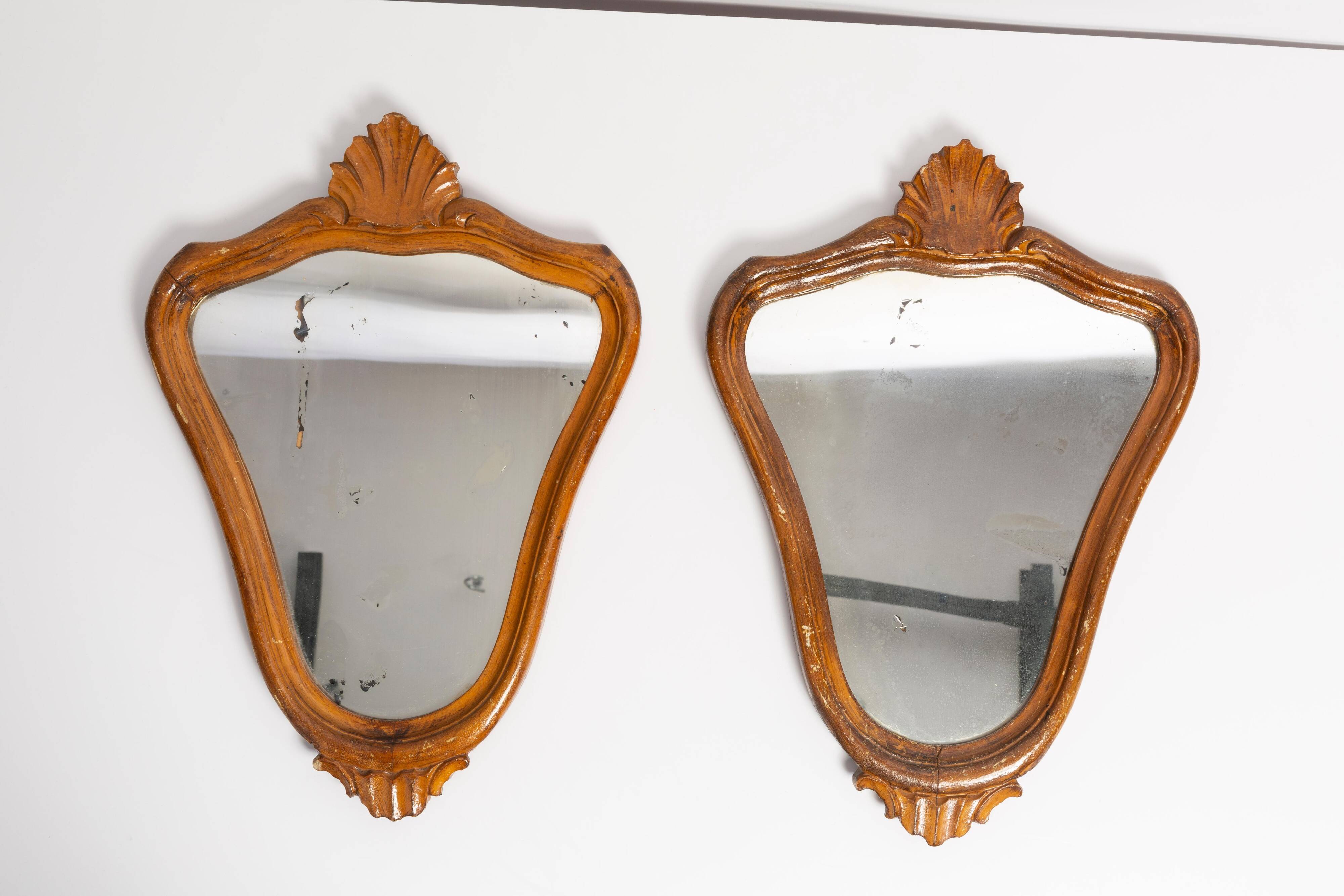Pair of vintage Mid-Century decorative mirrors in a gold frame, Italy, 1960s.